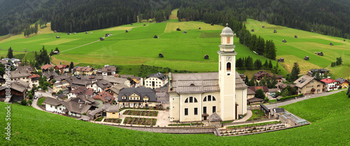 Church of Saints Peter and Paul in Sesto Pusteria. Panoramic view of Sesto Pusteria. South Tyrol, Italy.