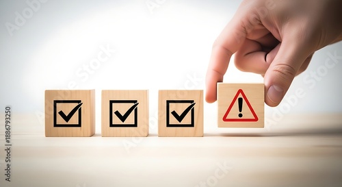 Hand adding a wooden block with a red warning triangle icon to a series of green checkmark blocks representing risk management and error detection.