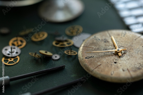Closeup image of a watchmaker's workshop with dissembled watches and tools