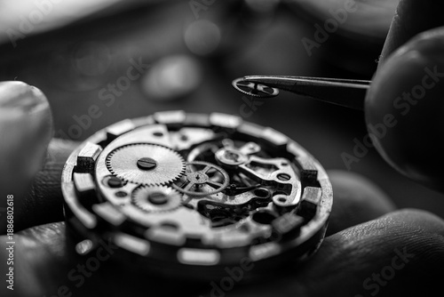 Closeup image of a watchmaker's workshop with dissembled watches and tools