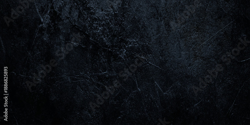 Dramatic dark wall concrete texture with heavy scratches weathered grit deep scratches, scuffs, and a weathered concrete appearance.