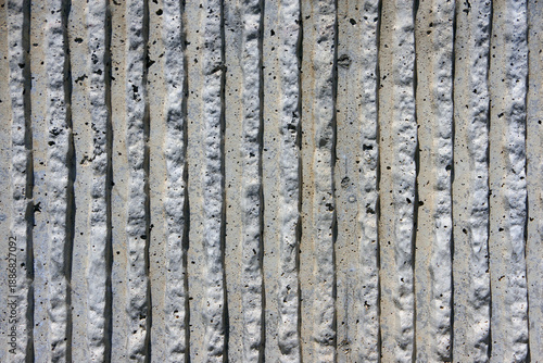 Concrete wall surface shaped in stripe pattern