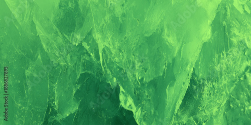 Green distressed concrete texture background with white scratches weathered stone surface using for minimalist website headers, botanical-themed designs.