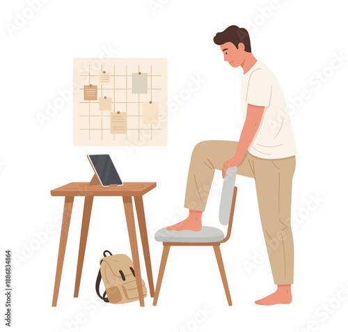 Man doing leg stretch at home office with tablet