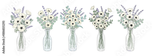 Set of glass vases with white anemone and lavender bouquets