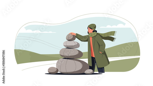 Woman Creating Stone Cairn In A Winter Landscape For Peace And Tranquility