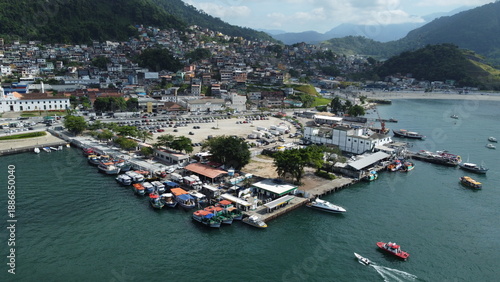 Angra Dos Reis, Brazil, January 13, 2025: Aerial drone photograph of colorful fishing boats moored at a pier in Angra dos Reis, Brazil