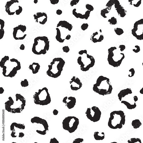 Cheetah leopard or jaguar skin pattern. Seamless black and white design for textile clothing and web usage. Grunge brush used, all hand drawn elements.