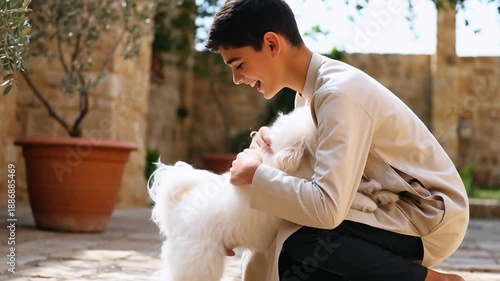 Wallpaper Mural Young boy joyfully interacting with a fluffy white dog in a sunny outdoor courtyard with green plants Torontodigital.ca
