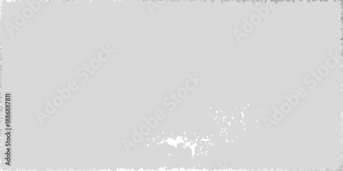 A predominantly gray image with a small cluster of white markings