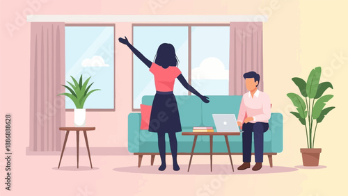 Two people in a living room, one standing with arms outstretched, one on laptop