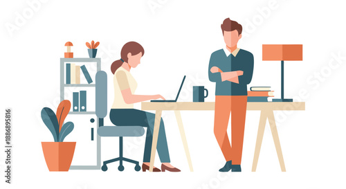 A woman works diligently on her laptop at a desk while a man stands attentively beside her in a modern office environment.