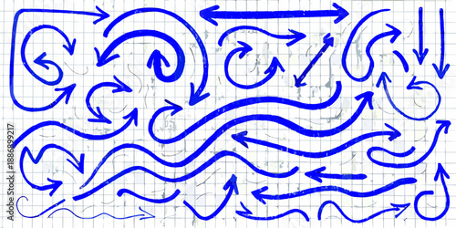 Collection of hand drawn blue arrows in various shapes and directions on grid paper