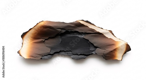 Burnt paper piece isolated on white background with charred edges