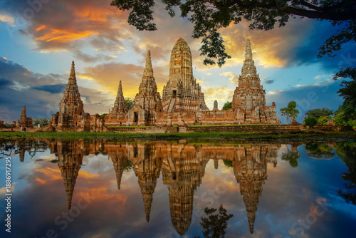 Ancient Thai pagoda of Wat Chaiwatthanaram at sunset with reflection, Ayutthaya, Thailand.