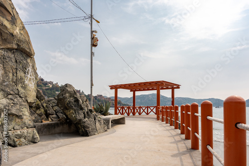 Bild auf Leinwand Panoramic view of the Zihuatanejo Boardwalk facing the sea in Costa Grande, Guerrero