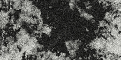Dark abstract monochrome background with a central black void surrounded by textured, grainy white and gray organic shapes, creating a dramatic contrast