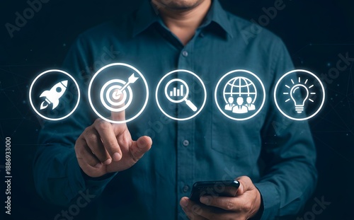 Wallpaper Mural Business professional is pointing to a central target icon, surrounded by business strategy and growth symbols. Torontodigital.ca