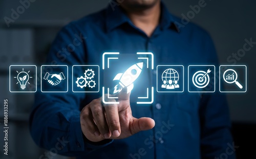 Wallpaper Mural Focus on innovation and business startup with a person touching a rocket icon in a virtual interface. Torontodigital.ca