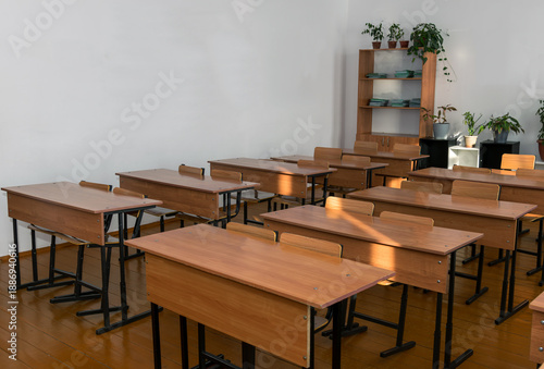a school classroom with no students. empty desks