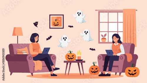 Two women on laptops surrounded by Halloween decorations