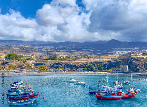 Yachts and fishing boats in nthe harbour at Puerto Playa de San Juan, Teriffe, Spain.