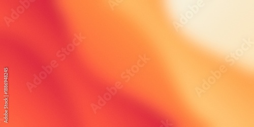 Abstract orange and red grainy gradient background with soft light leak