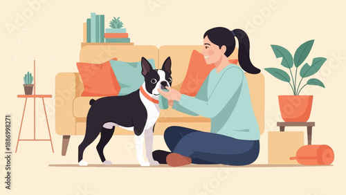 Woman giving treat to Boston terrier dog inside a cozy living room