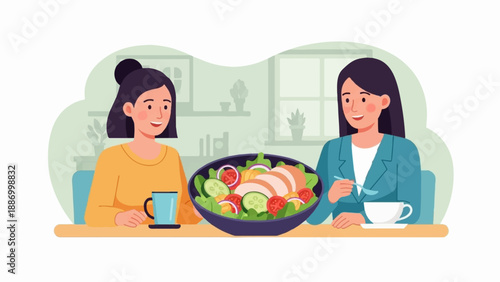 Two women sharing a healthy salad lunch at a table indoors