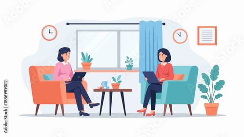 Two women sit in comfortable chairs, each using a laptop, in a cozy indoor setting with plants