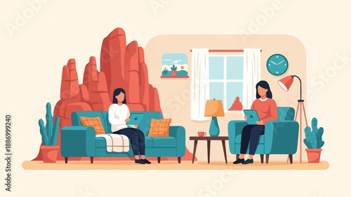 Two women sitting indoors on comfortable furniture, using tablets