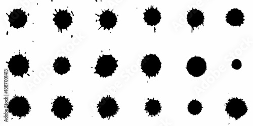 Abstract arrangement of dark irregular ink blots on a white background