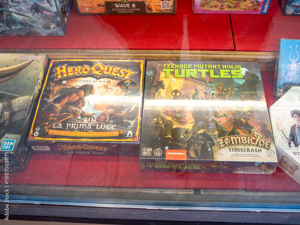 Fototapeta premium HeroQuest, Zombicide, Teenage Mutant Ninja Turtles, Harry Potter board games and tabletop RPG boxes for sale in a store
