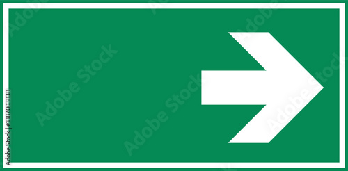 green directional sign with white arrow pointing right
