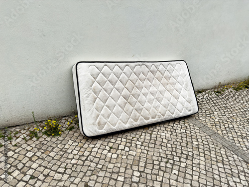 Dirty Mattress On Lisbon Sidewalk