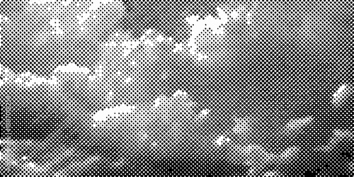 Abstract grayscale texture with scattered bright spots and grainy mottled effect