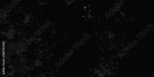 Dark grainy texture with scattered bright specks resembling a night sky