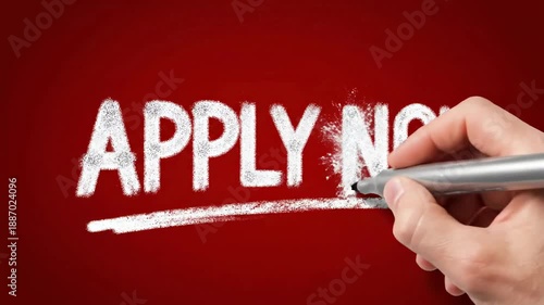 Hand writing APPLY NOW on a red background, encouraging immediate action and application.