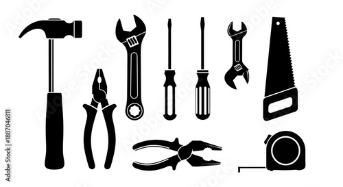 Collection of various tools including hammer, wrenches, pliers, and screwdrivers arranged neatly on a surface