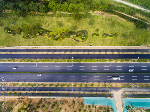 Canvas Print Aerial Highway Shot with Green Median and Nature Blending