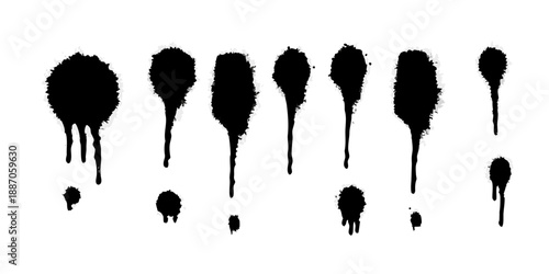 A collection of black spray paint drips and splatters on a white background