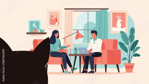 A couple sits in matching chairs in a living room with a cat watching