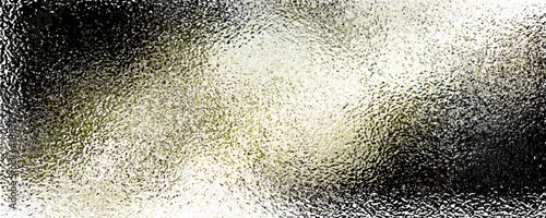 Wet black surface with water drops, reflecting light.