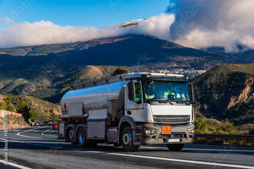 Obraz na płótnie Heating fuel and industrial fuel tanker truck on a mountain highway