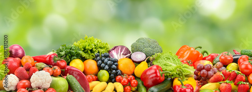 Assorted Fresh Fruits and Vegetables Banner on Natural Green Background with Copy Space for Nutrition, Diet and Wellness Concepts
