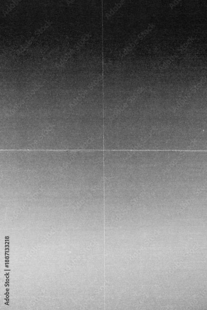 Fototapeta premium Abstract grayscale background with subtle grain texture, soft gradient tones, and visible fold and scratch lines. The image has a vintage paper and film scan aesthetic.