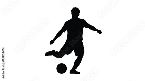 Silhouette of a soccer player kicking a ball in dynamic motion