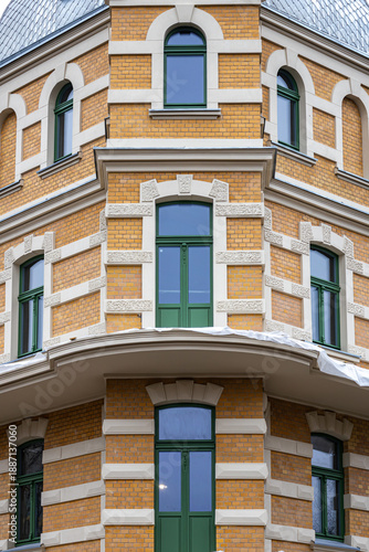 Wallpaper Mural Historic brick building corner with green windows, renovated European architecture Torontodigital.ca