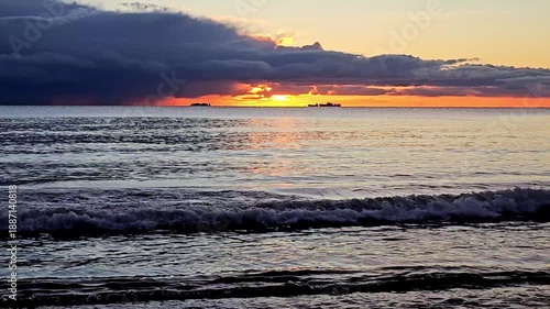 Dark storm clouds on the sea horizon