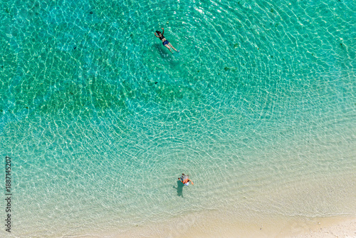 Top-down Aerial View of Tourists Swimming and Floating in Crystal Clear Turquoise Tropical Water.